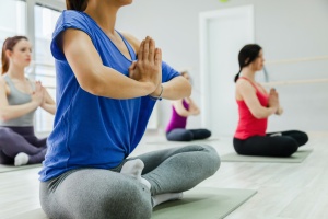 women doing yoga poses for stress