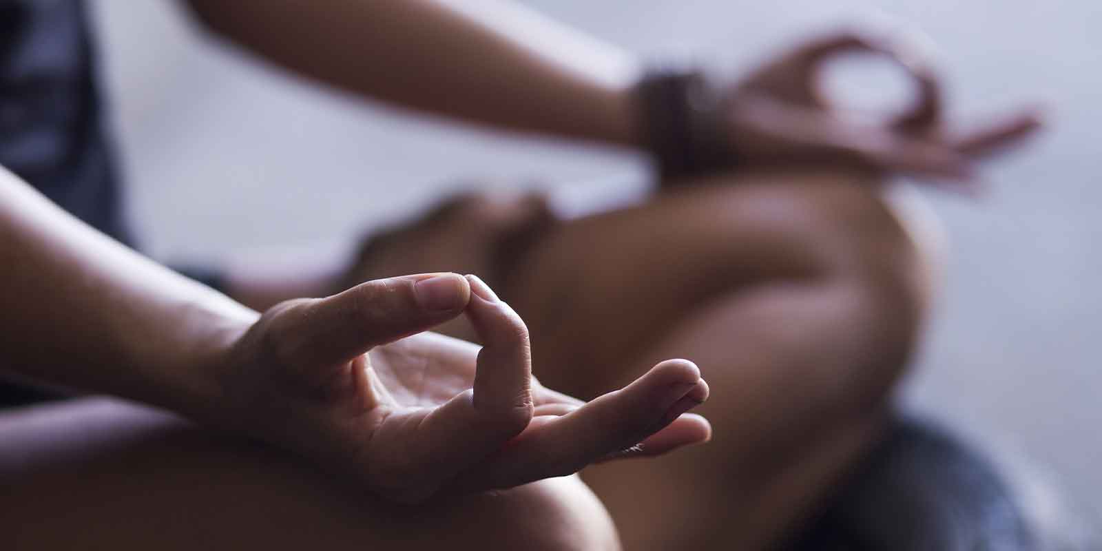 hands of someone doing a at home yoga sequence