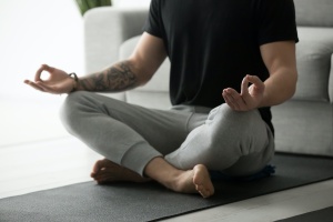 man working on a at home yoga sequence