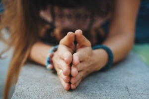 womens hands working on yoga for anxiety