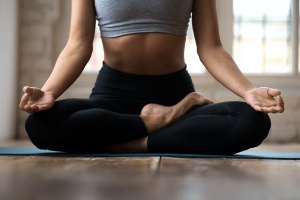 women practicing pranayama in butterfly pose