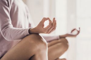 close up of women who is practicing yoga's fingers