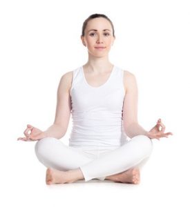 women sitting on the floor with legs crossed