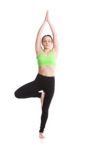 women holding tree pose with strait arms
