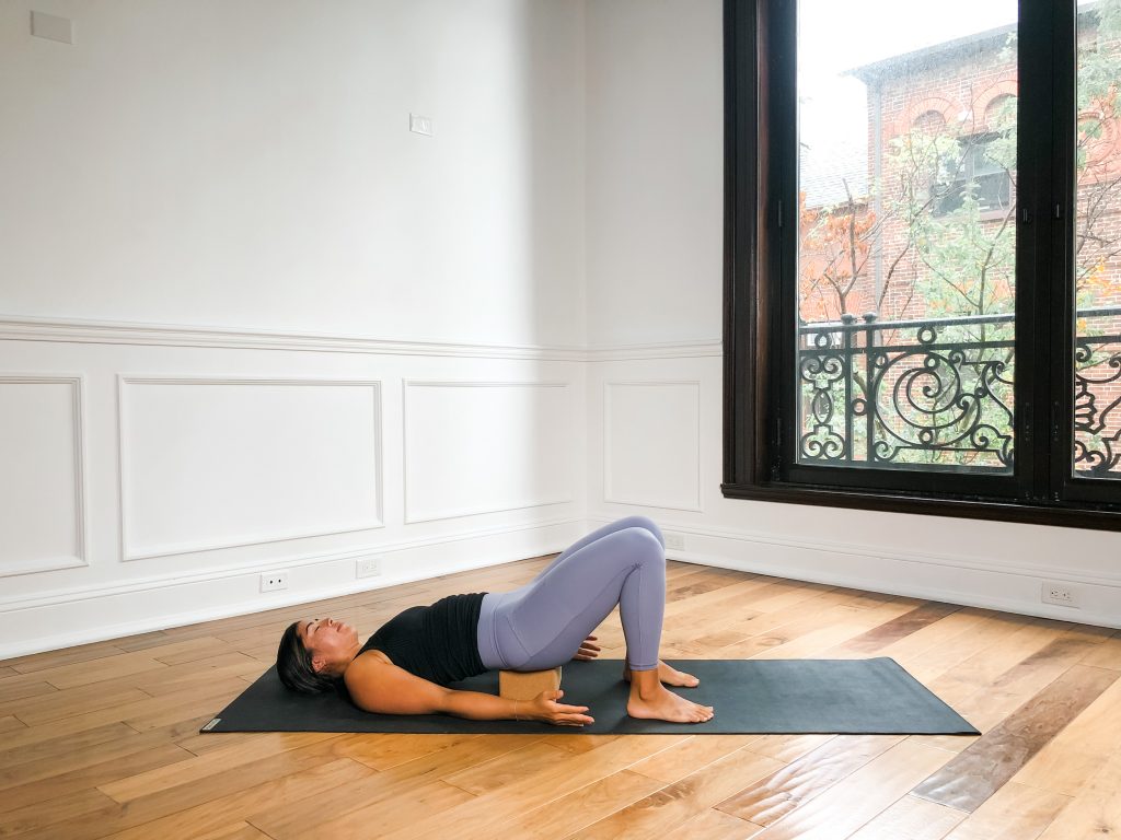 Person in Supported Bridge Pose