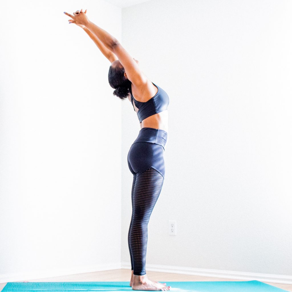 Woman doing a standing yoga pose