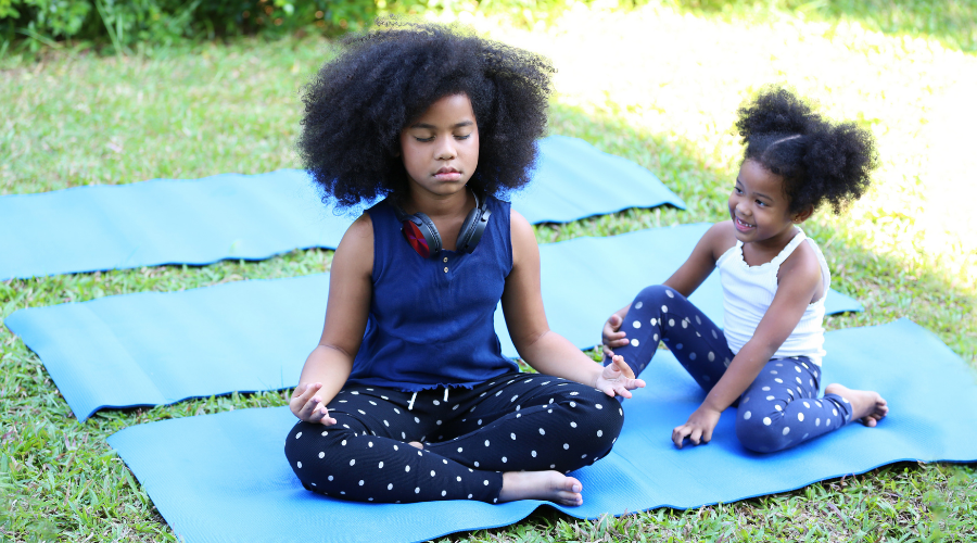 Children doing yoga outside