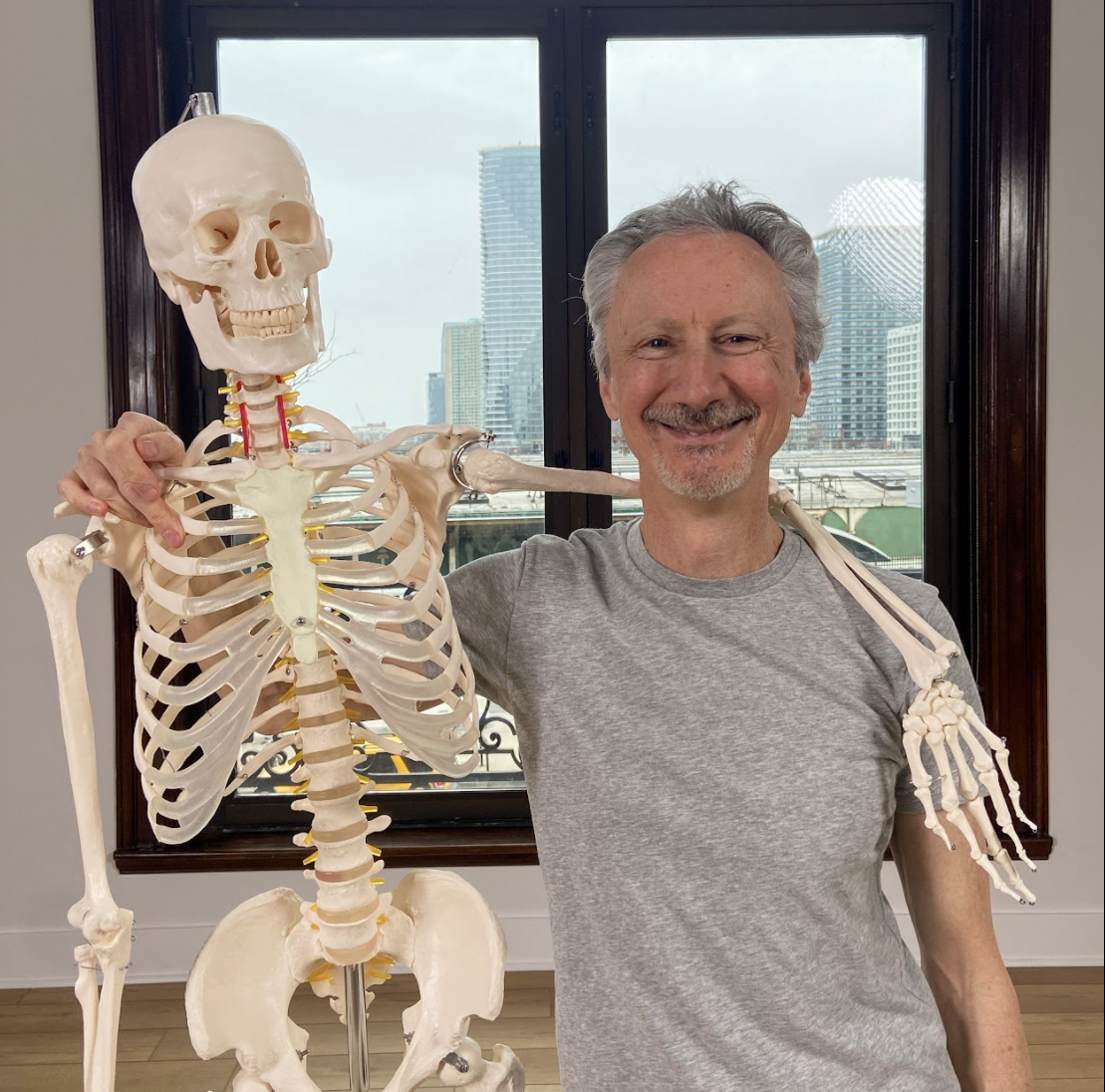 Joe posing with a skeleton