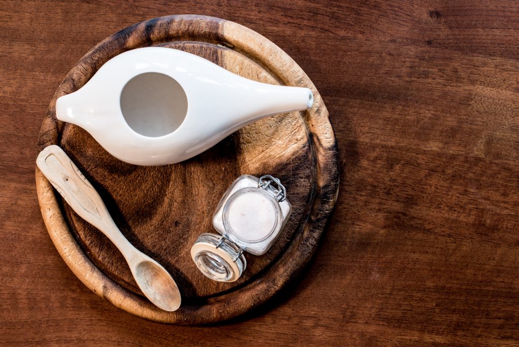 A neti pot on a table