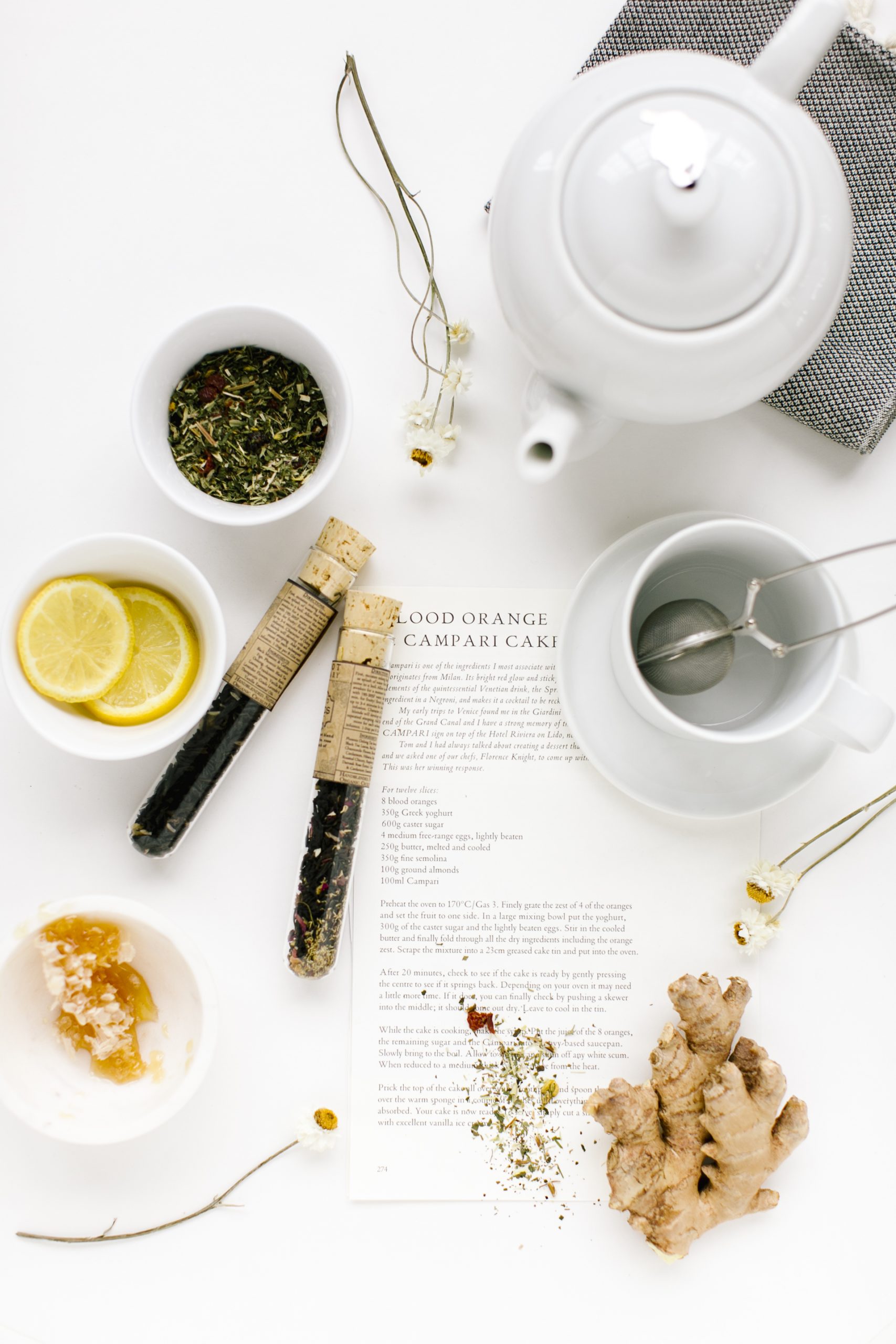 Teapot, ginger, lemon on a table