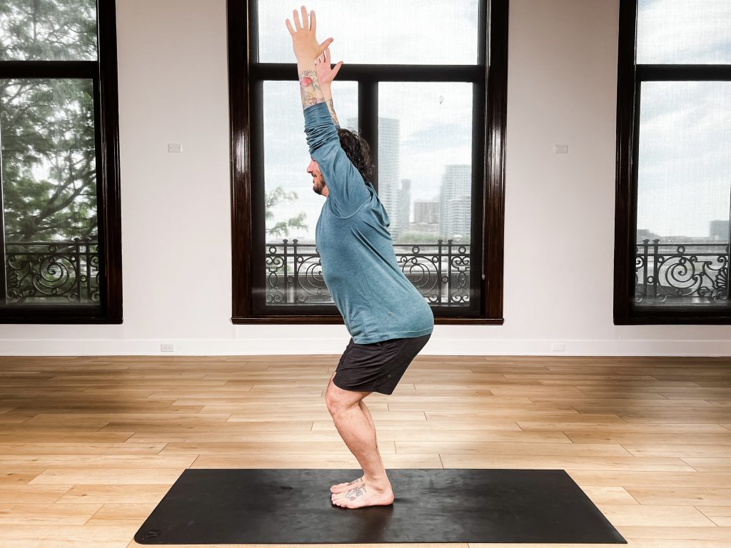 Yogi man in chair pose