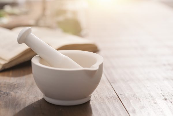 Ayurveda book and mortar and pestle