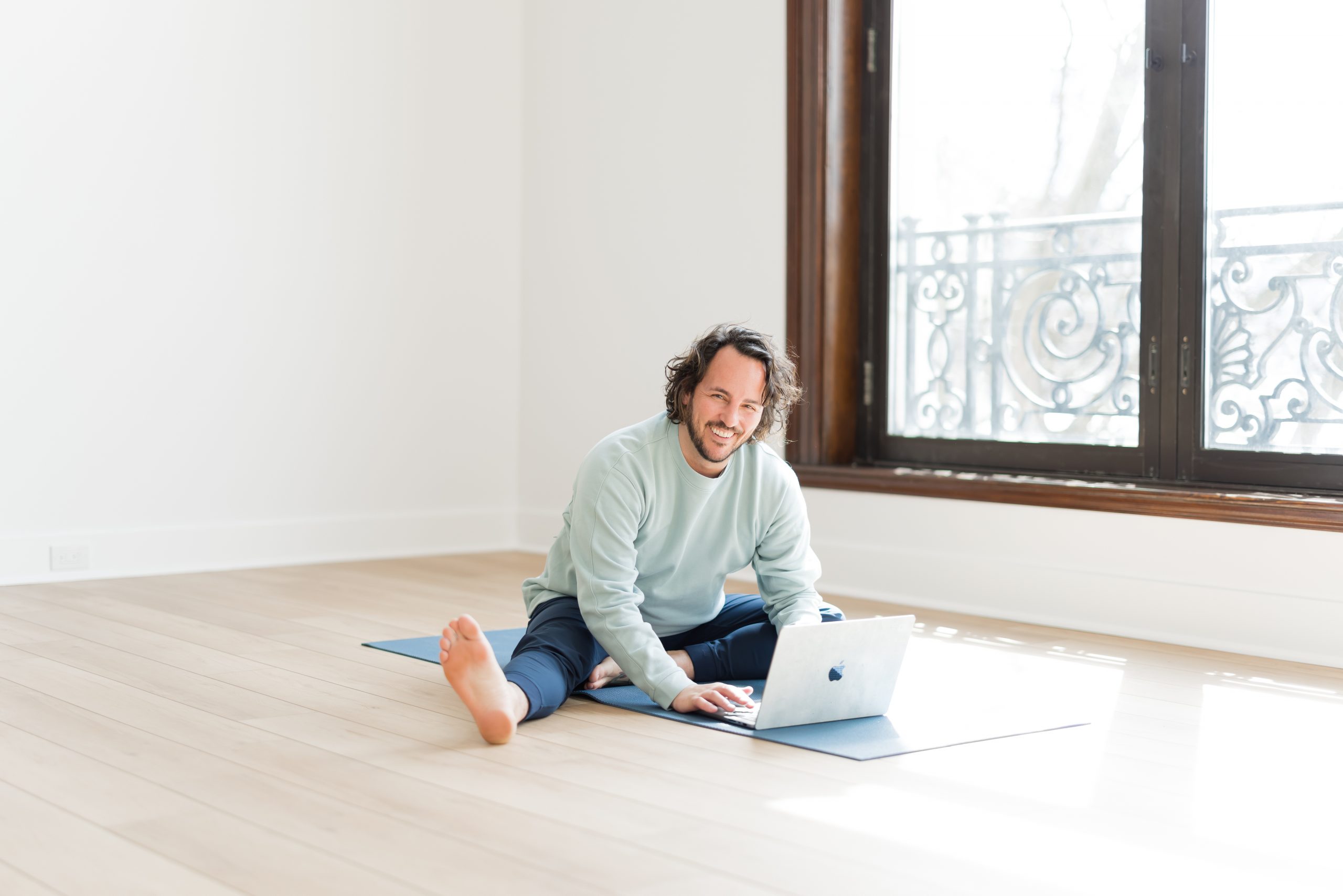 Patrick from YogaRenew looking up yoga classes online