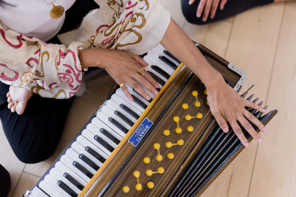 Yoga Philosophy - hands playing the harmonium