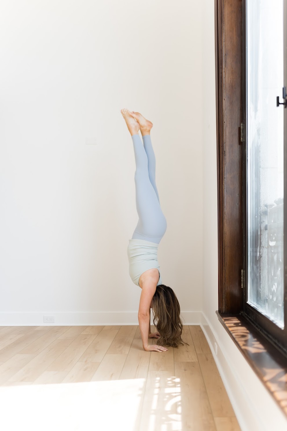 Kate Lombardo in Handstand near the wall