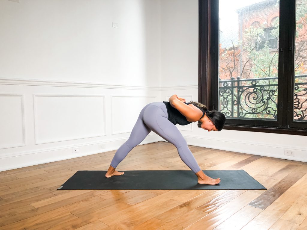 Pyramid pose with reverse prayer hands