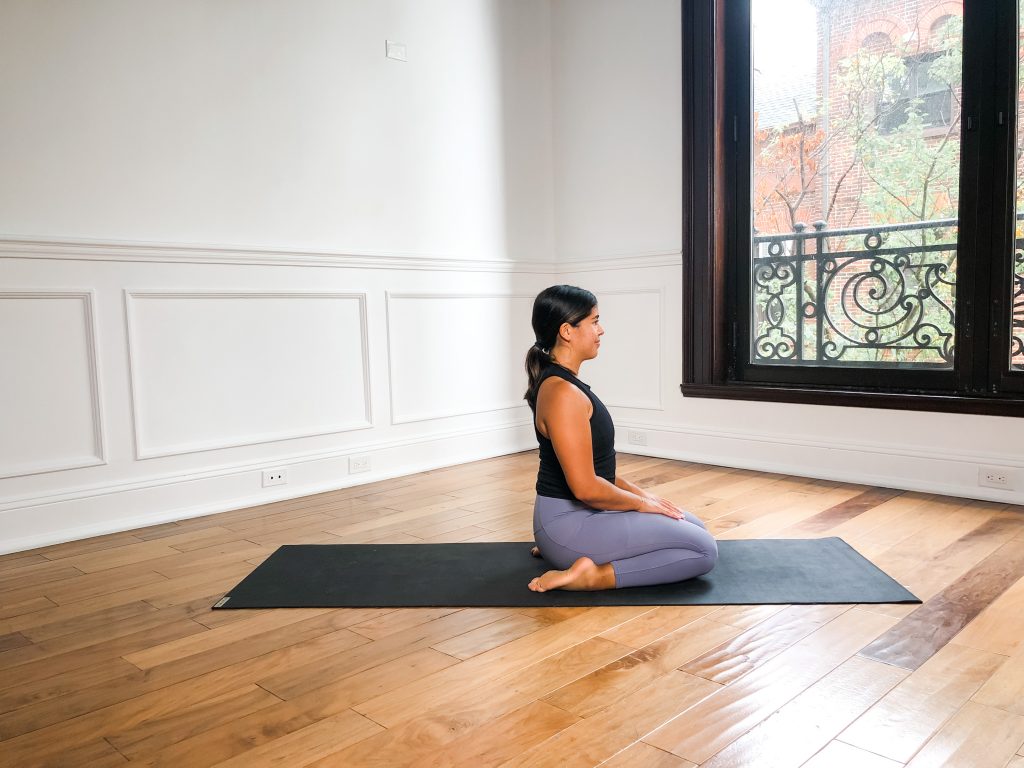 girl sitting in thunderbolt pose