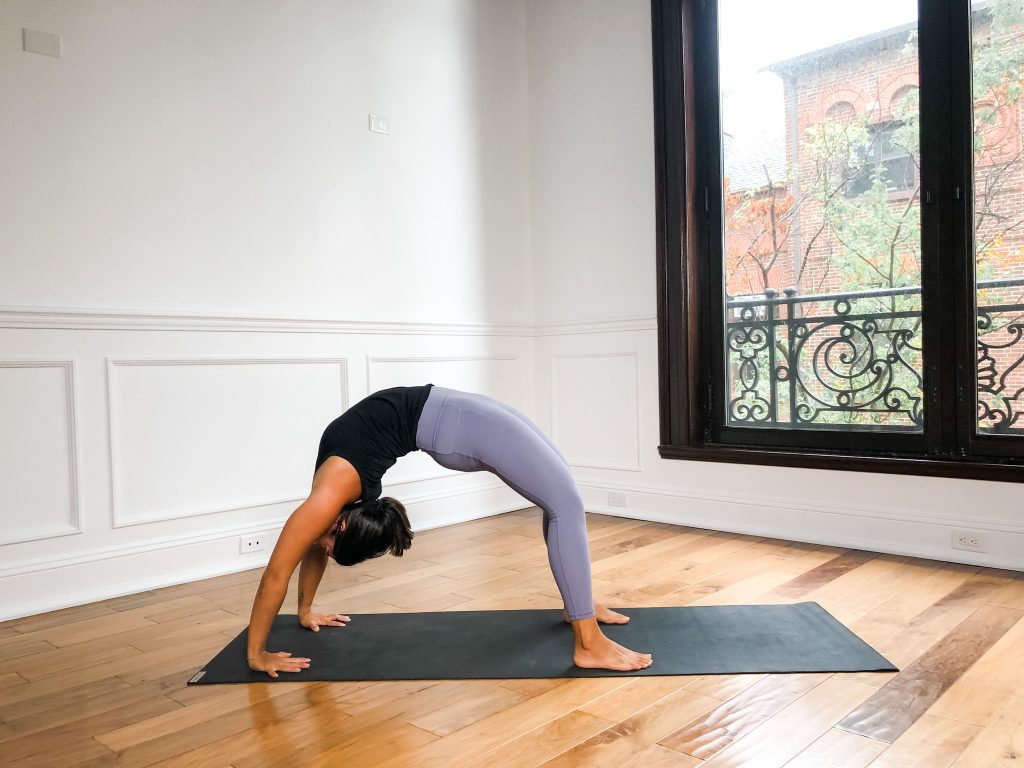 Girl in full wheel pose