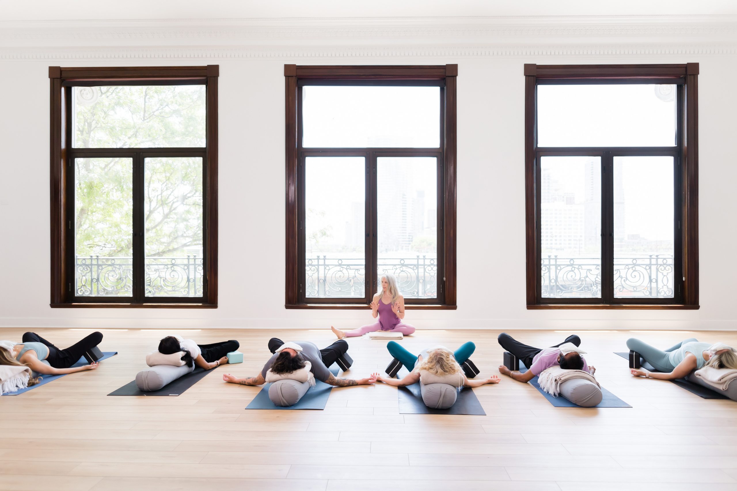 A restorative yoga class (teacher and students)