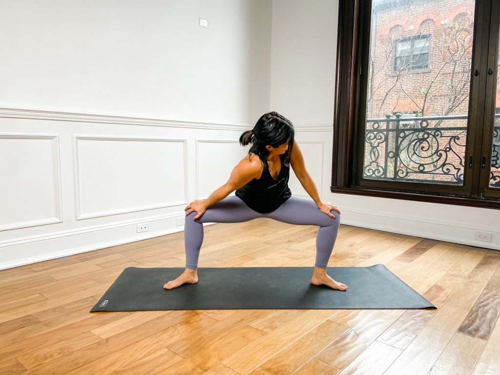 Person doing Goddess Pose with their groin stretched