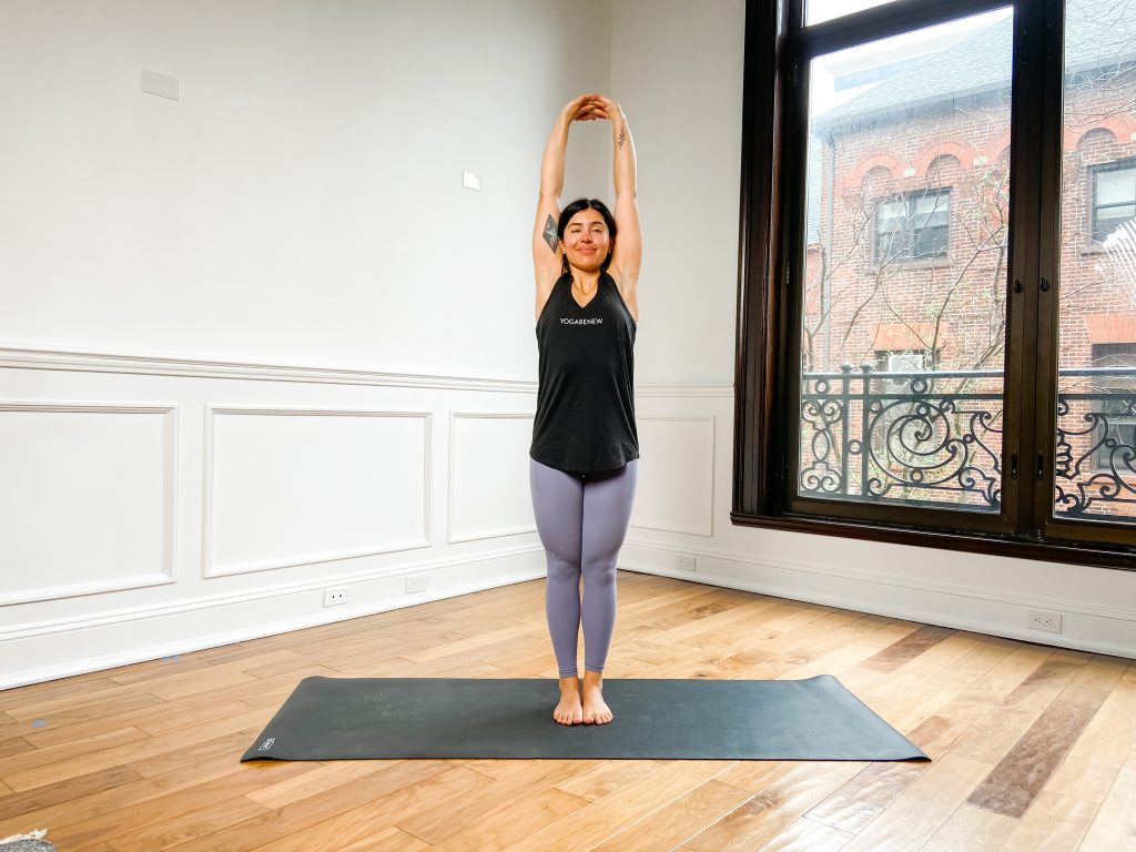 Woman on a yoga mat with Upward Bound Hands