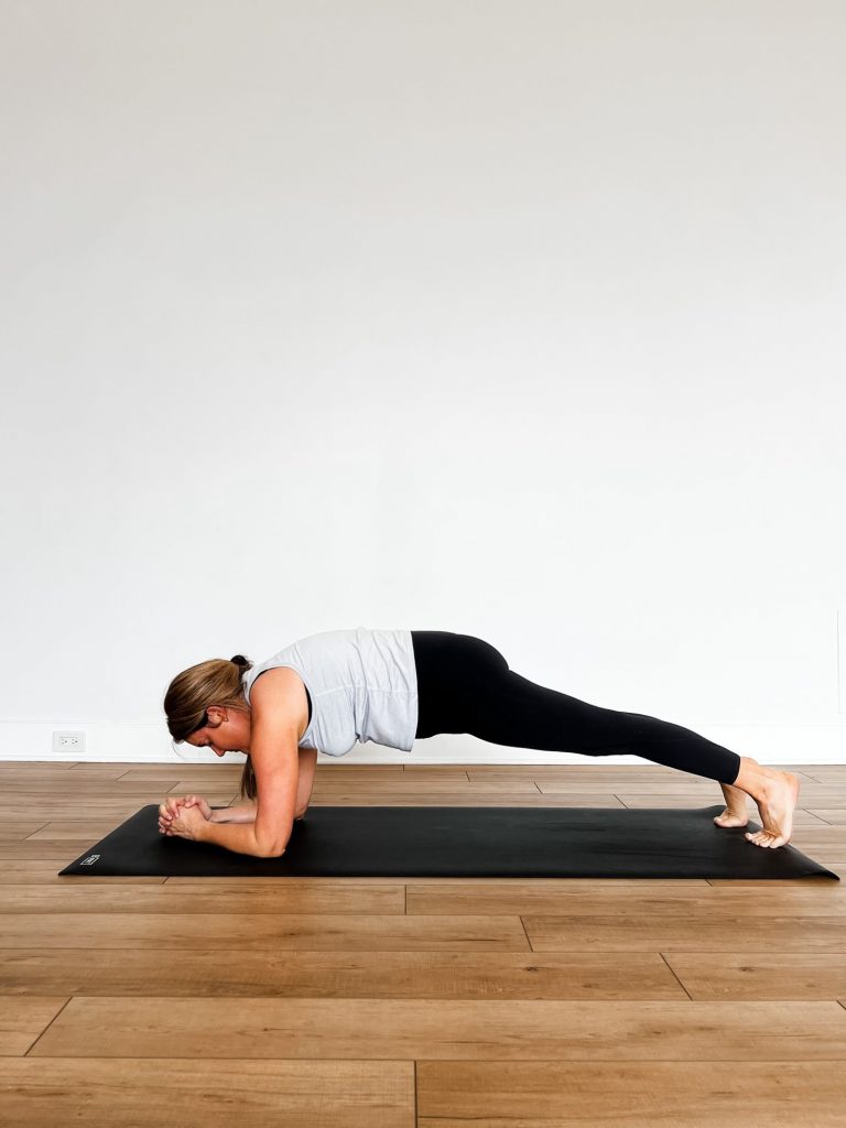 Forearm plank with fingers interlaced