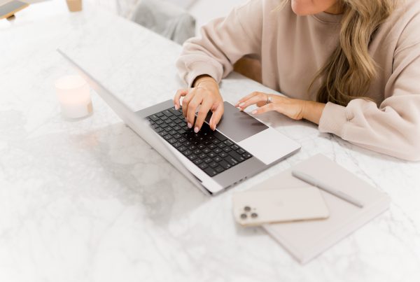 A woman's hands on a laptop - Going Digital as a Yoga Teacher