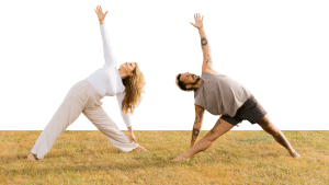 Kate and Patrick hero image of them both in triangle pose on the grass