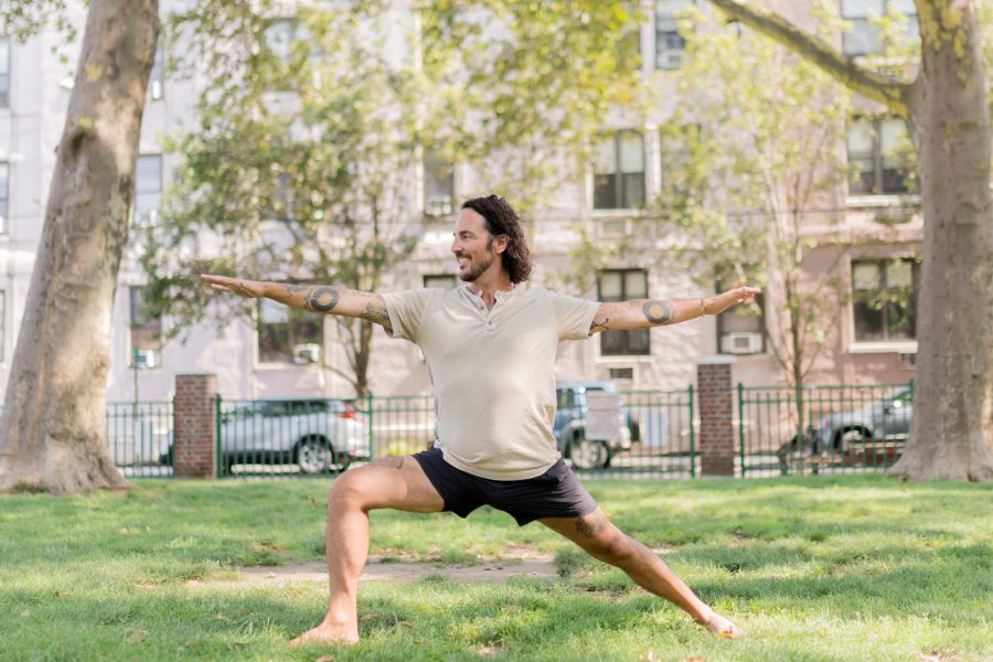 Patrick Franco in Warrior II to promote a 10 minute morning yoga flow