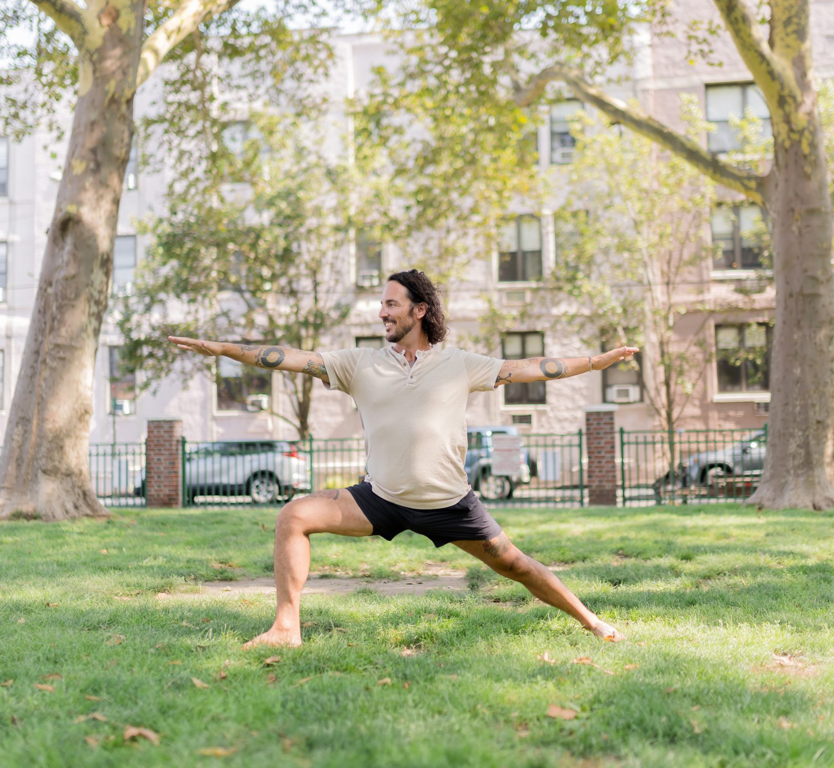 Patrick Franco in Warrior II to promote a 10 minute morning yoga flow