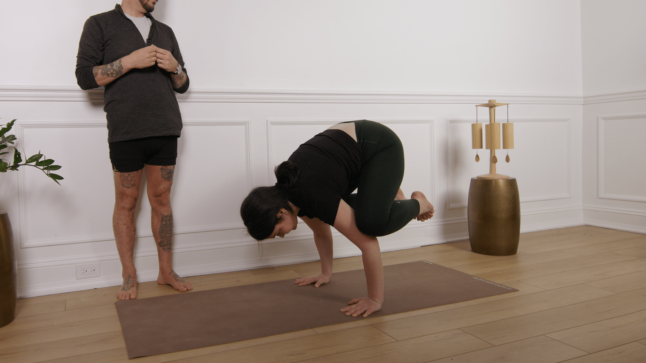 Mélie Purdon in crow pose for the yogarenew app