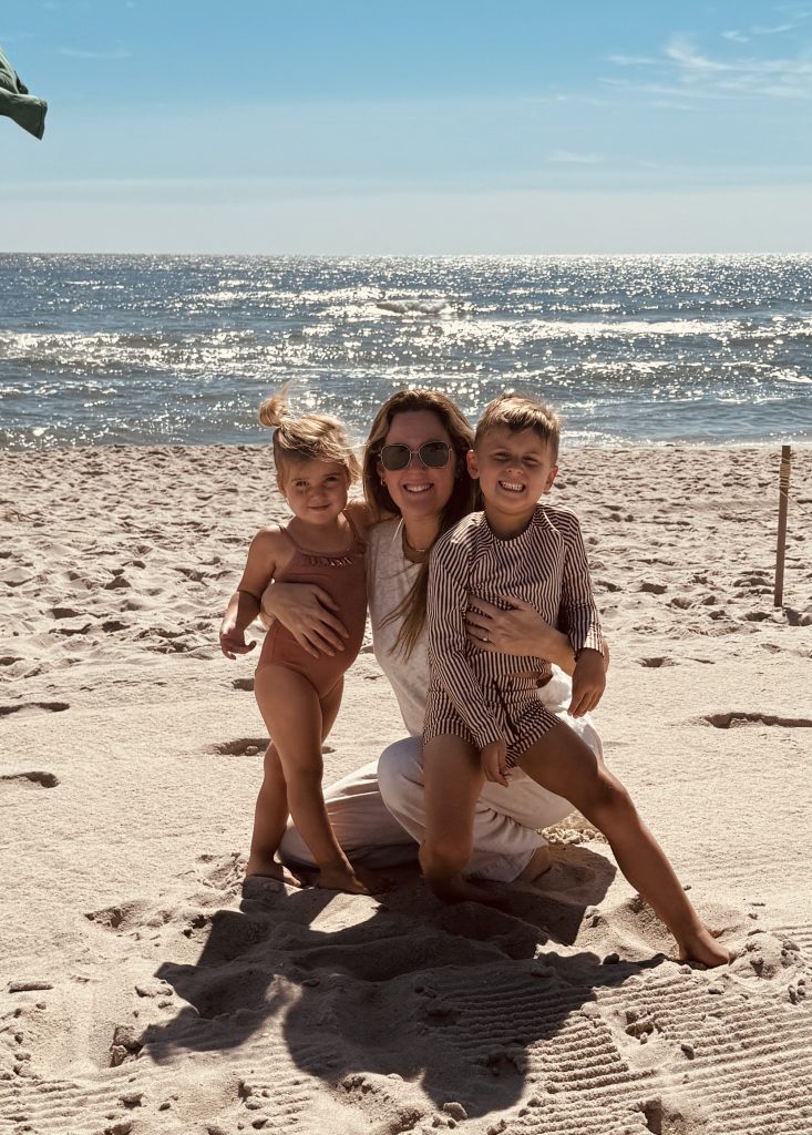 Kate Lombardo hugging her two children