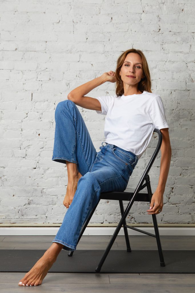 Lindsey Rozmes sitting in a chair headshot