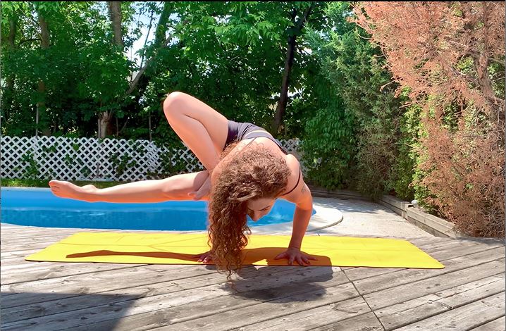 Rajaa Azouqa in Dragonfly pose