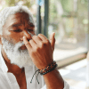 Black man practicing alternate nostril breathing