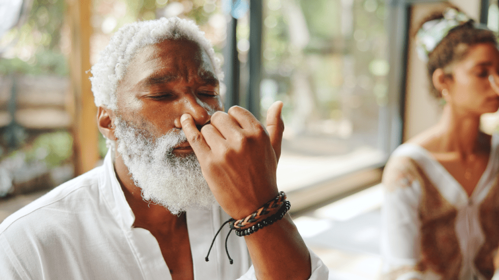 Black man practicing alternate nostril breathing