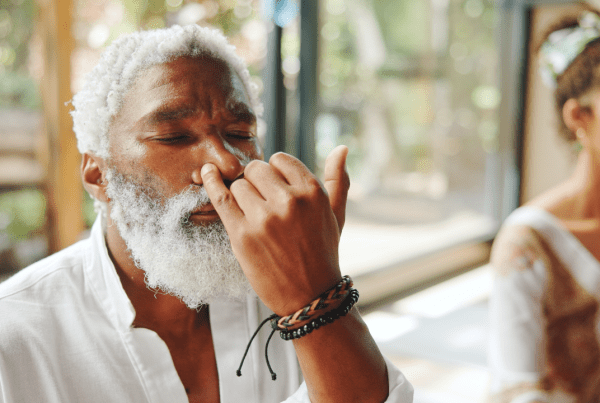 Black man practicing alternate nostril breathing