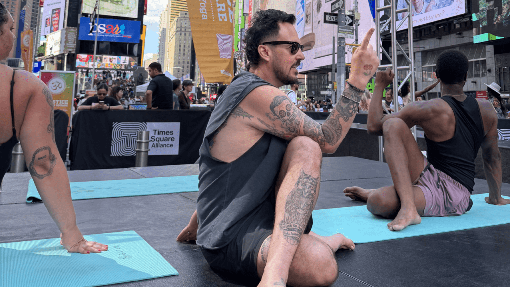 Patrick Franco teaches in Times Square for International Yoga Day