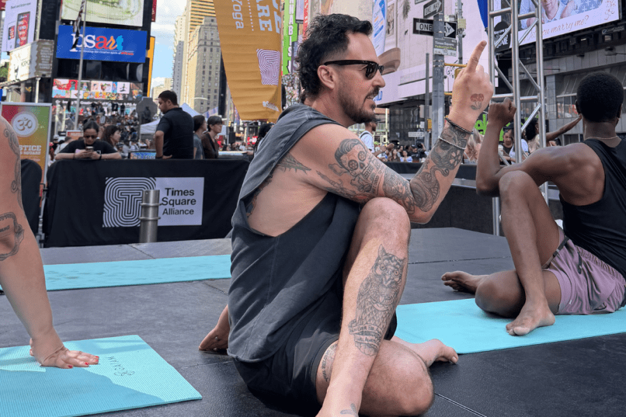 Patrick Franco teaches in Times Square for International Yoga Day