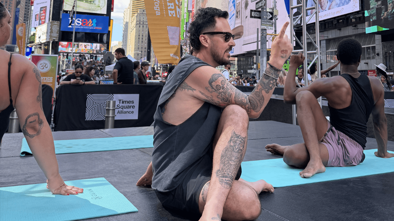 Patrick Franco teaches in Times Square for International Yoga Day