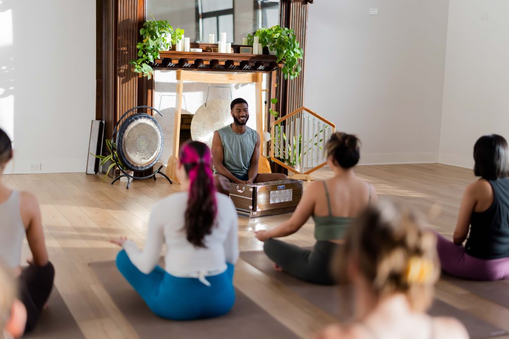 Yoga teacher leading a workshop as a part-time teaching opportunity